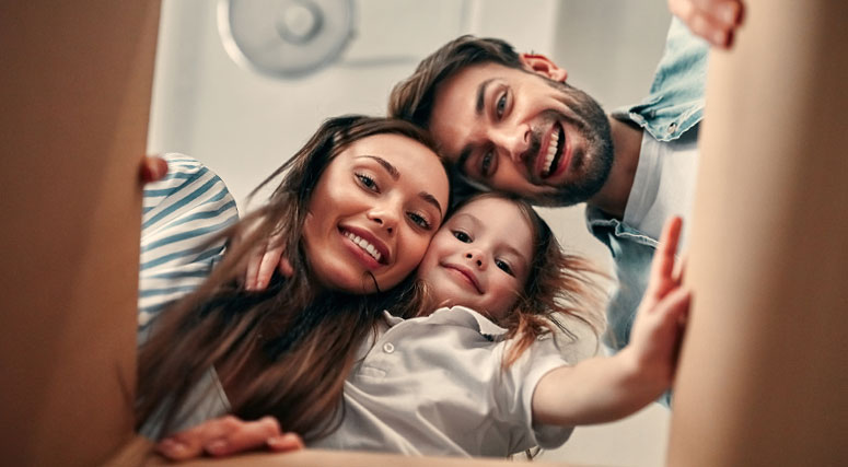 Family looking in a box.